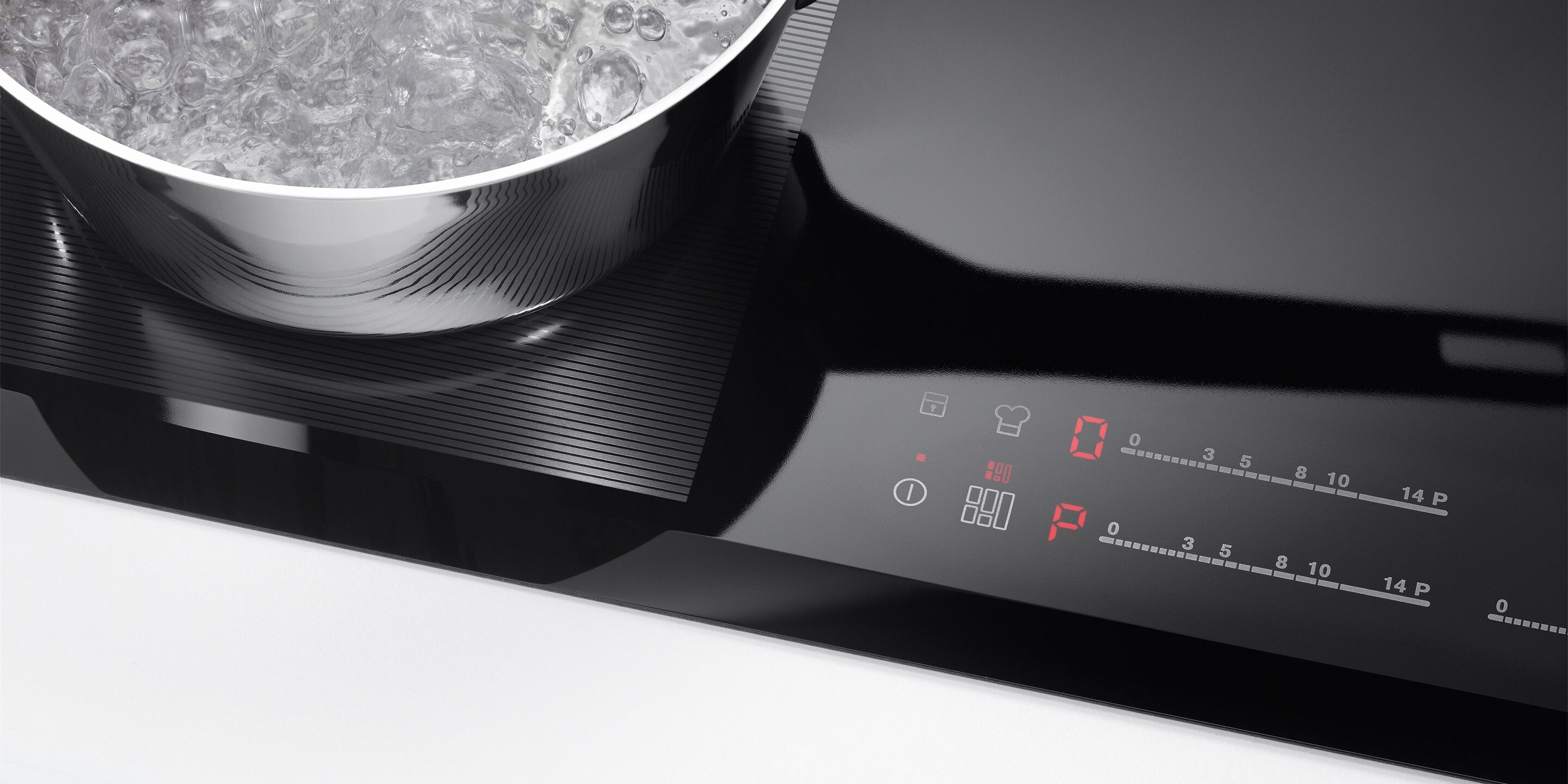 Кнопка «старт/стоп» на індукційній варильній панелі Electrolux