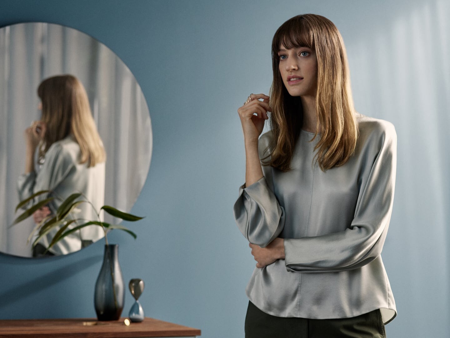 woman in front of a mirror