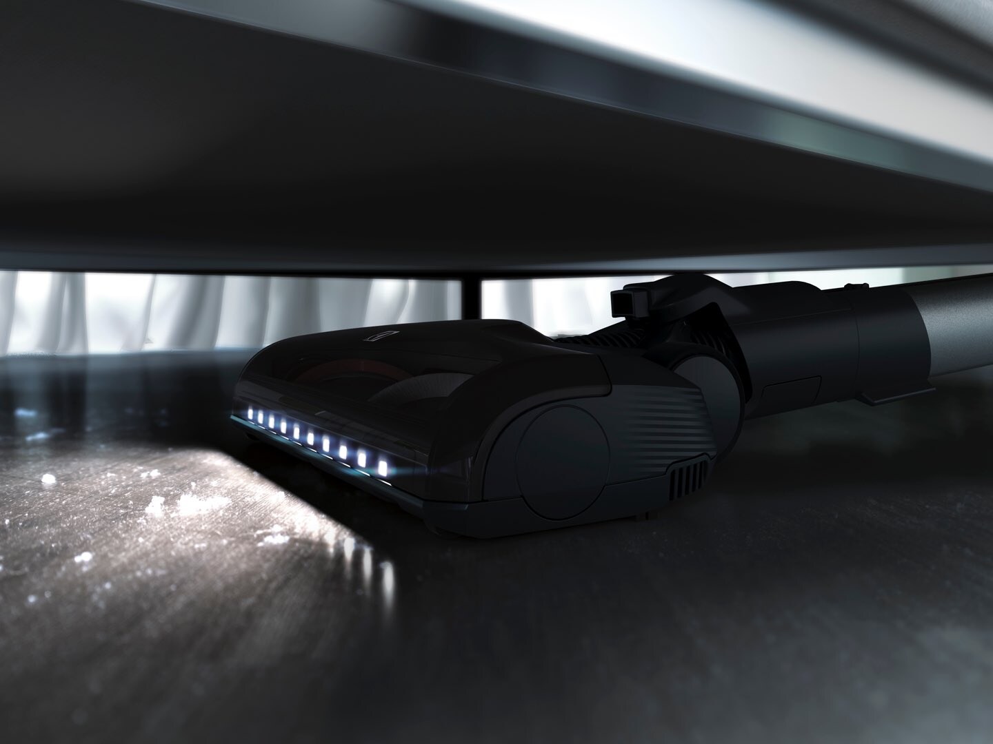vacuuming underneath furniture