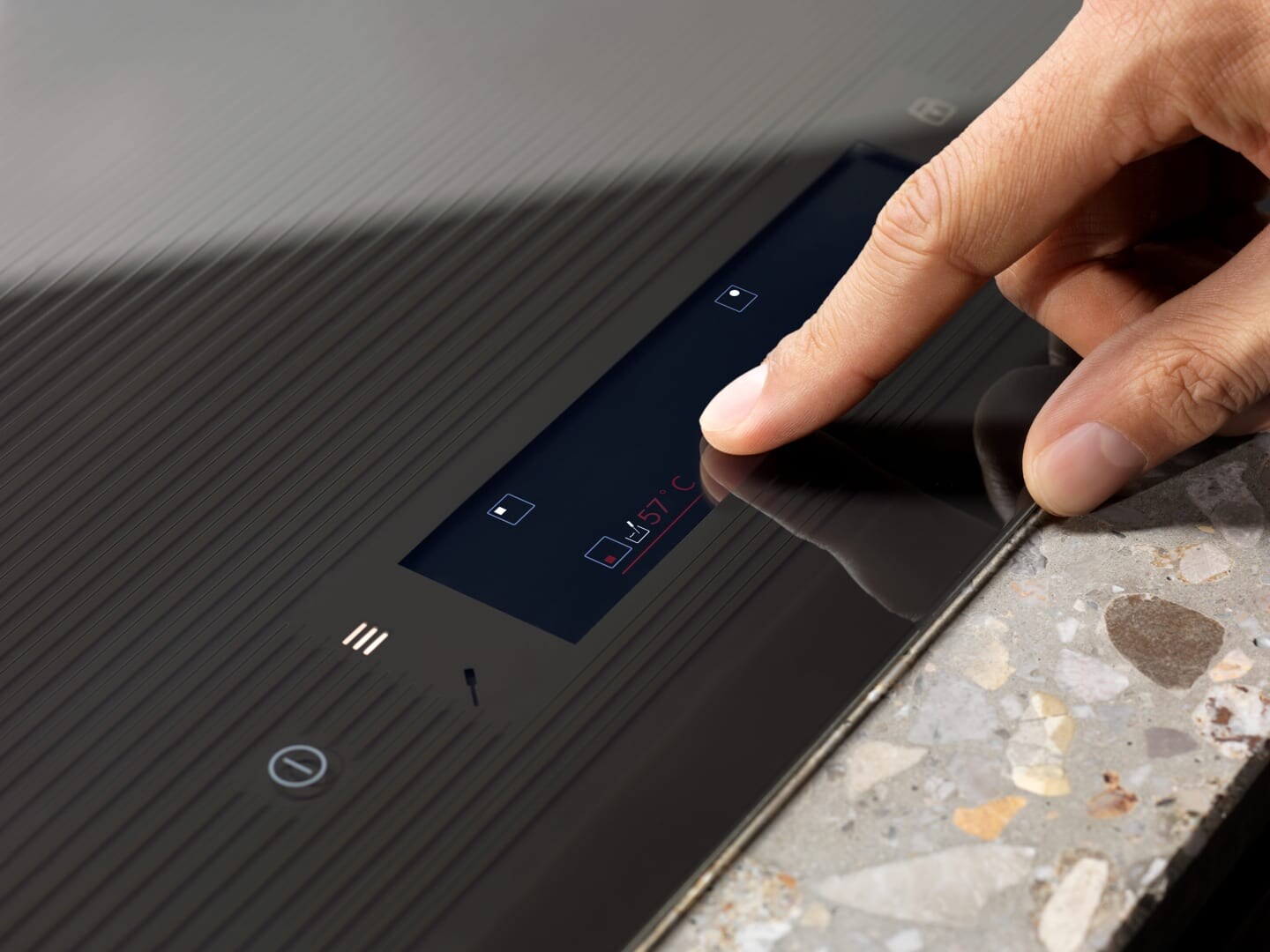 adjusting temperature on touchscreen on hob